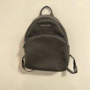 MICHAEL KORS SIGNATURE LOGO BLACK ON BLACK BACKPACK SILVER DETAILS FAUX LEATHER